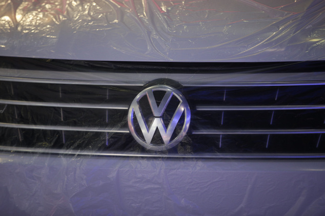 The 2016 Volkswagen Passat is covered in a plastic sheet at the Volkswagen booth Tuesday Nov. 17 2015 in Los Angeles. The auto show opens to the public F