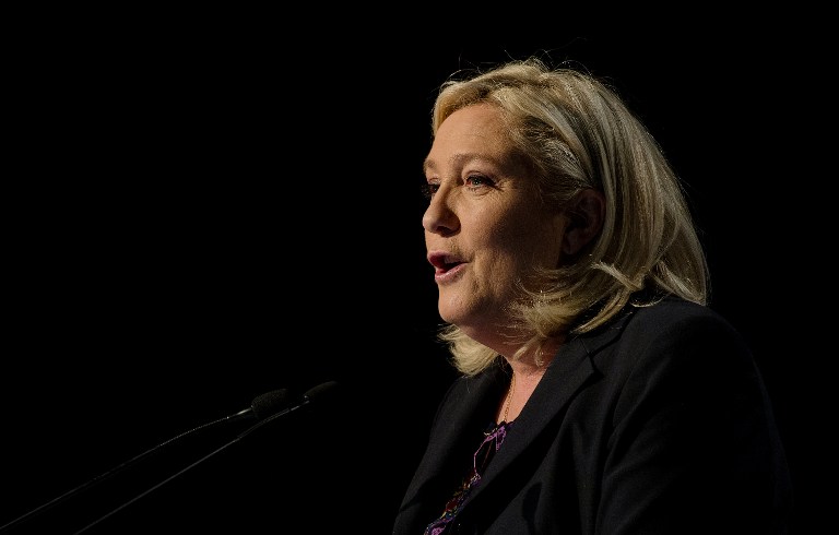 French far-right National Front leader Marine Le Pen delivers a speech following the second round of French regional elections in Henin Beaumont