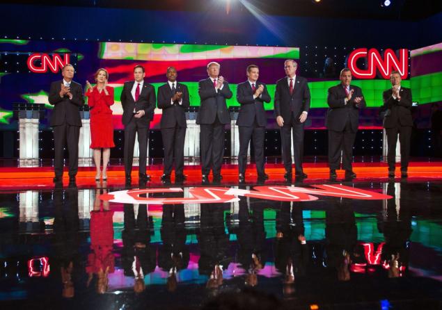 Republican presidential candidates John Kasich Carly Fiorina Marco Rubio Ben Carson Donald Trump Ted Cruz Jeb Bush Chris Christie and Rand Paul stand on stage at the start of CNN’s latest Republican presidential debate