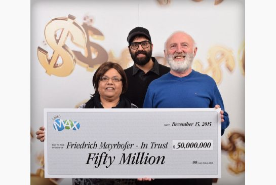 Annand Mayrhofer Eric Mayrhofer and Friedrich Mayrhofer pose with their $50-million winning lottery cheque in Vancouver Tuesday. However George Wilson Tagoe says he is the rightful winner and is taking the B.C.'s lottery agency to court