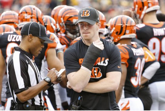 Bengals quarterback Andy Dalton prowls the sideline after breaking his thumb early in Sunday's loss to the Steelers