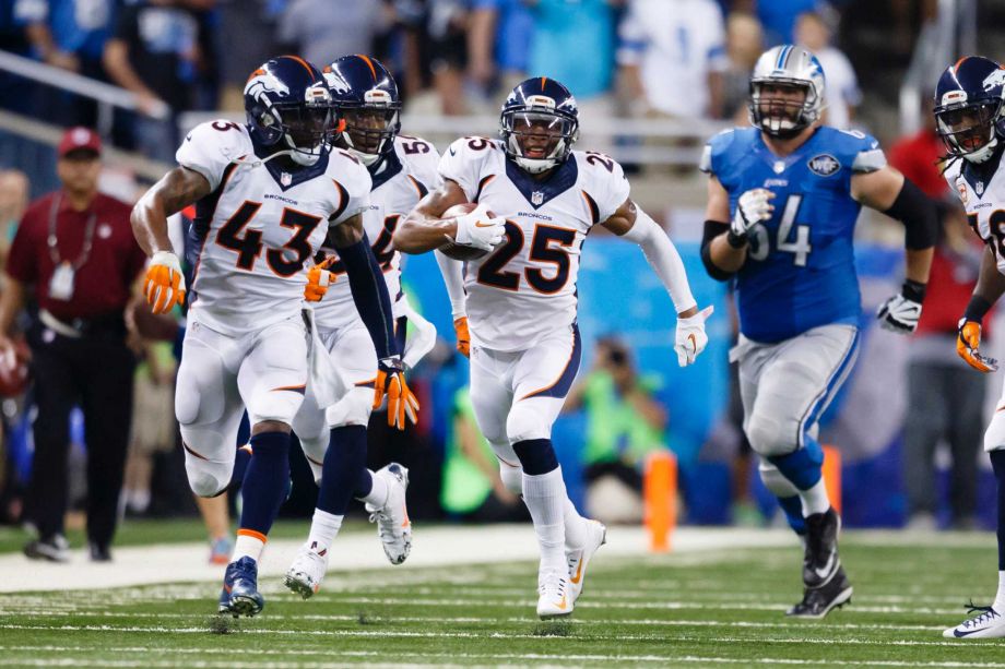 Denver Broncos cornerback Chris Harris runs the ball after a blocked extra point attempt against the Detroit Lions during an NFL football game at Ford Field in Detroit. Denver’s defense which finished No