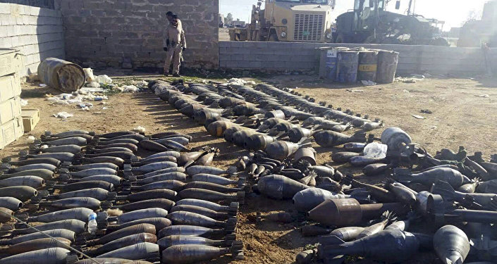 Weapons and explosives confiscated by Iraqi security forces from Islamic State militants are on display at an Iraqi army base as security forces advance their position in northern Ramadi 70 miles west of Baghdad Iraq