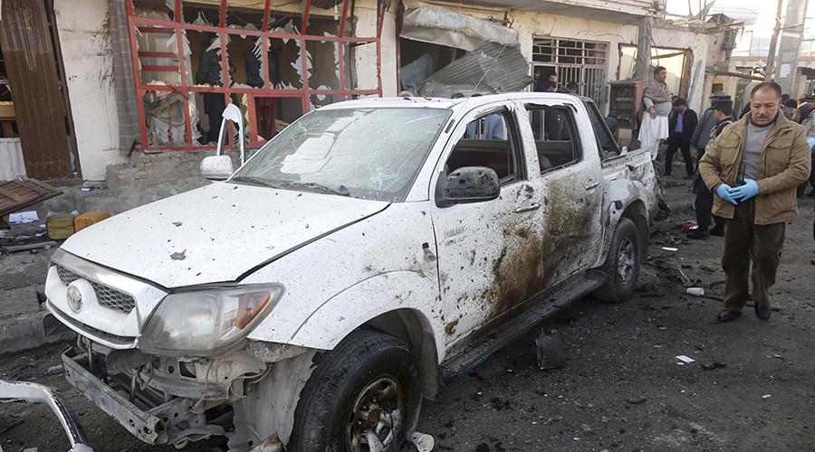 Afghan security forces investigate at the site of a suicide bomb attack in Kabul Afghanistan