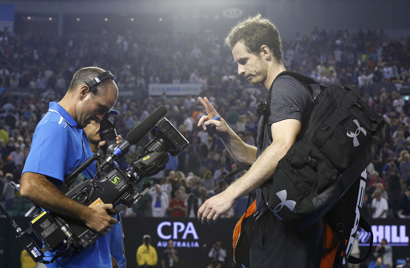 Britain's Murray gestures at a cameraman after winning his fourth round match against Australia's Tomic at the Australian Open tennis tournament at Melbourne Park