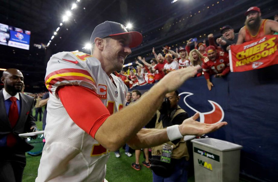 Kansas City Chiefs quarterback Alex Smith runs off the field following an NFL wild-card playoff football game against the Houston Texans Saturday Jan. 9 2016 in Houston. Kansas City won 30-0