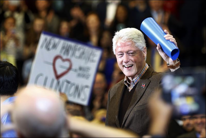 Former President Bill Clinton waves to a cheering crowd as he arrives during a campaign stop for his wife Democratic presidential candidate Hillary Clinton on Monday in Nashua N.H