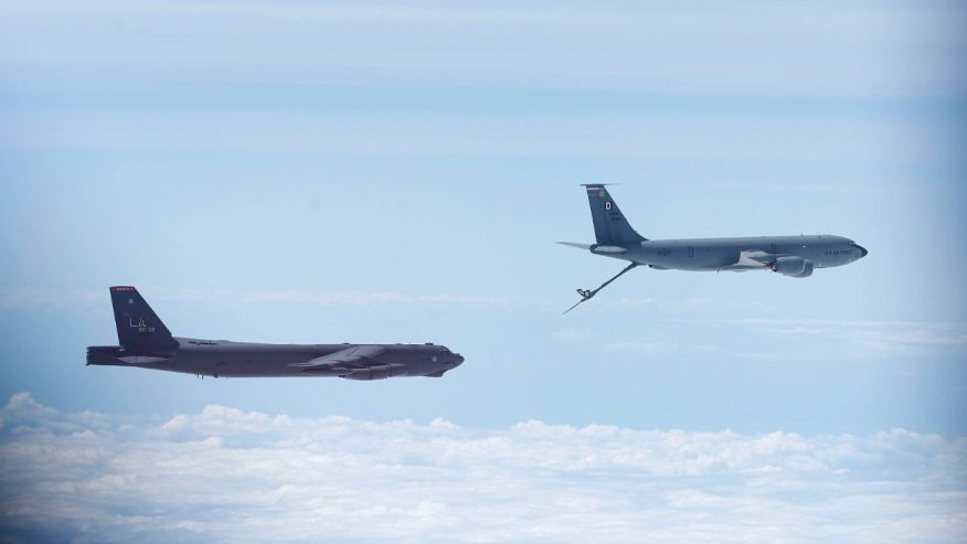 A U.S. Air Force B-52 is seen through the window of another as it prepares for a mid-air refuel during a training mission in the United Kingdom's airspace