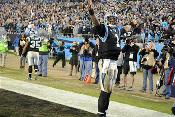 Carolina Panthers quarterback Cam Newton celebrates a touchdown pass against the Tampa Bay Buccaneers in the second half of an NFL football game in Charlotte N.C. Sunday Jan. 3 2016