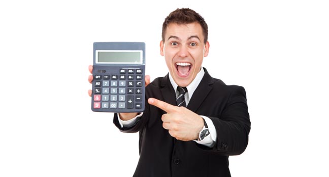 Grinning man in suit points at a calculator meaningfully. Pic via Shutterstock