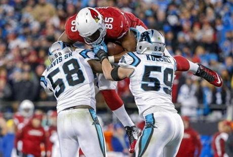 Erik S. Lesser  EPA		Panthers linebacker Thomas Davis suffered a broken right forearm while making this play in the second quarter on Sunday