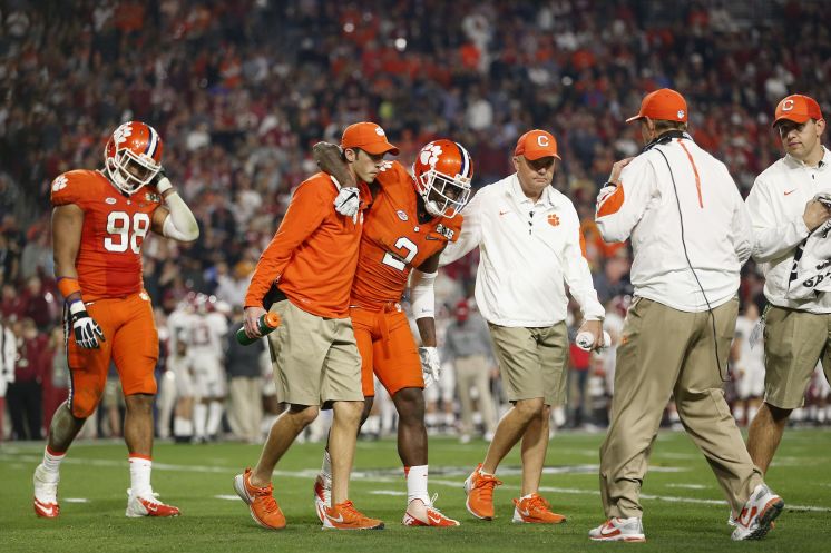 Clemson CB Mackensie Alexander who had a hamstring injury going into the game is helped off the field in the second quarter