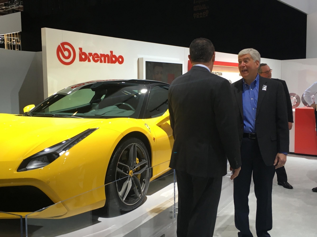 Gov. Snyder tours the floor of the North American International Auto Show at Detroit’s Cobo Center on Tuesday