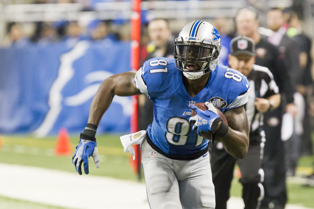 27 DECEMBER 2015 Detroit Lions wide receiver Calvin Johnson runs with the ball after catching a pass during game action between the San Francisco 49ers and the Detroit Lions during a regular season game played at Ford Field in Detroit Michigan