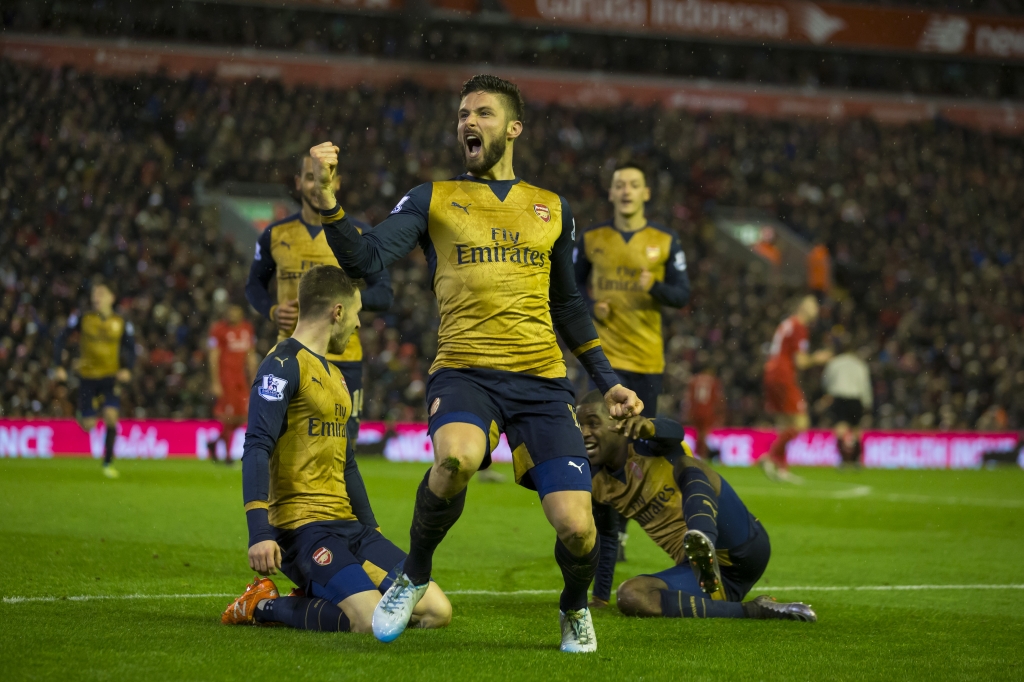 Arsenal's Olivier Giroud centre celebrates with teammates after scoring his second goal during the English Premier League soccer match between Liverpool and Arsenal at Anfield Stadium Liverpool England Wednesday Jan. 13 2016. AP