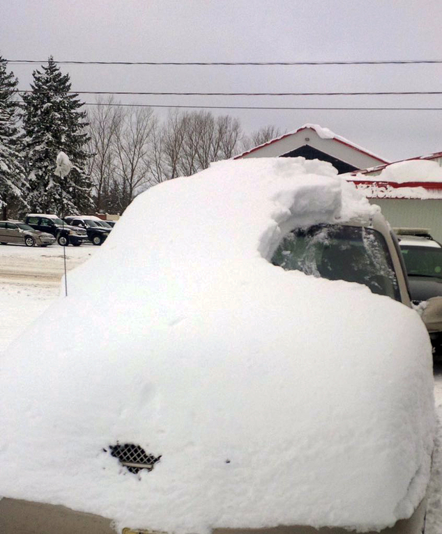 Ontario Provincial Police shows a snow covered vehicle in Brussels Ontario. An 80-year-old man has been