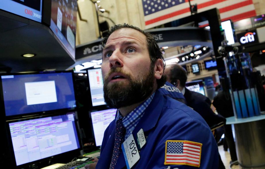 Michael Pistillo Jr. follows stock prices at the New York Stock Exchange Friday Jan. 15 2016