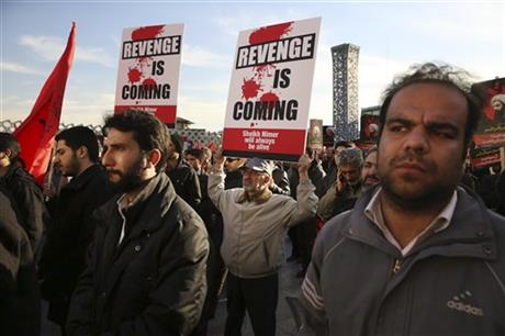 Iranian demonstrators hold anti Saudi placards in a rally to protest the execution by Saudi Arabia last week of Sheikh Nimr al-Nimr a prominent opposition Saudi Shiite cleric in Tehran Iran Monday Jan. 4 2016