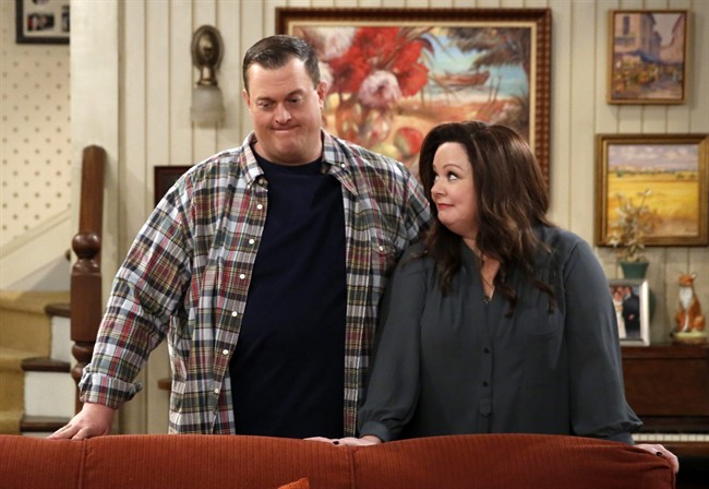 In this image released by CBS Billy Gardell left and Melissa Mc Carthy appear in a scene from