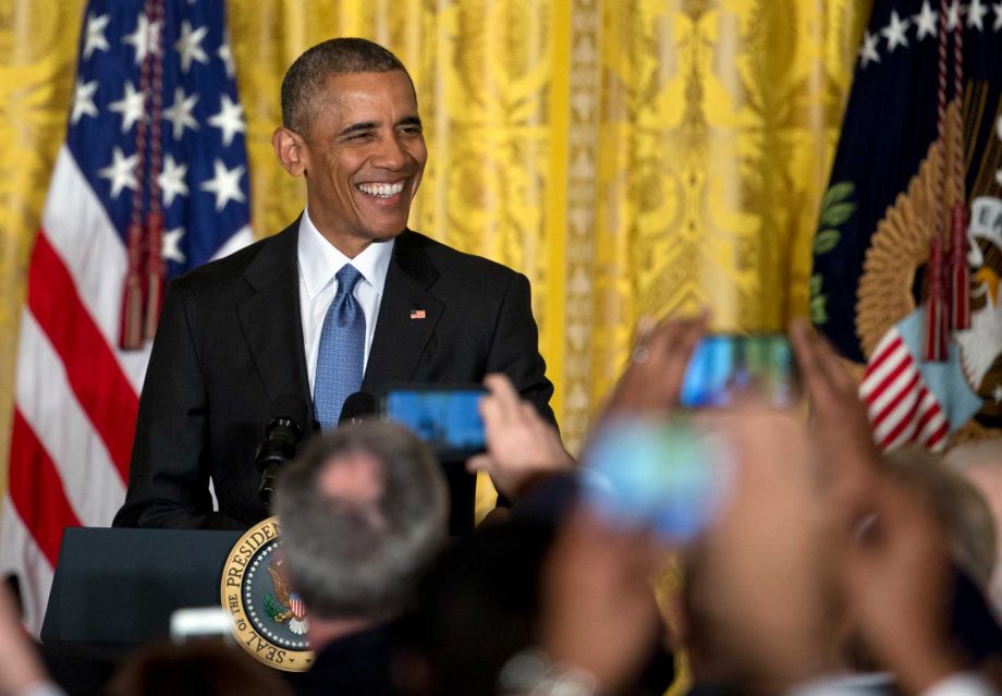 President Barack Obama smiles as he arrives to speak to mayors from around the country Thursday Jan. 21 2016 in the East Room of the White House in Washington. They visited the White House as part of the Winter Meeting of the U.S. Conference of Mayors