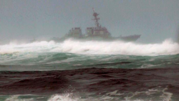 RETRANSMIT FOR IMPROVED TONING- A search vessel cruises the waters off the beach at Haleiwa Hawaii Friday Jan. 15 2016. Two Marine helicopters carrying 12 crew members collided off the island of Oahu during a nighttime training mission and rescuers