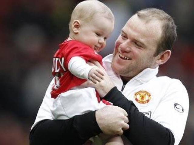 Proud father Wayne Rooney with his son Kai