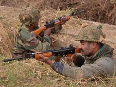 Soldiers take position on the perimeter of Air Force base in Pathankot