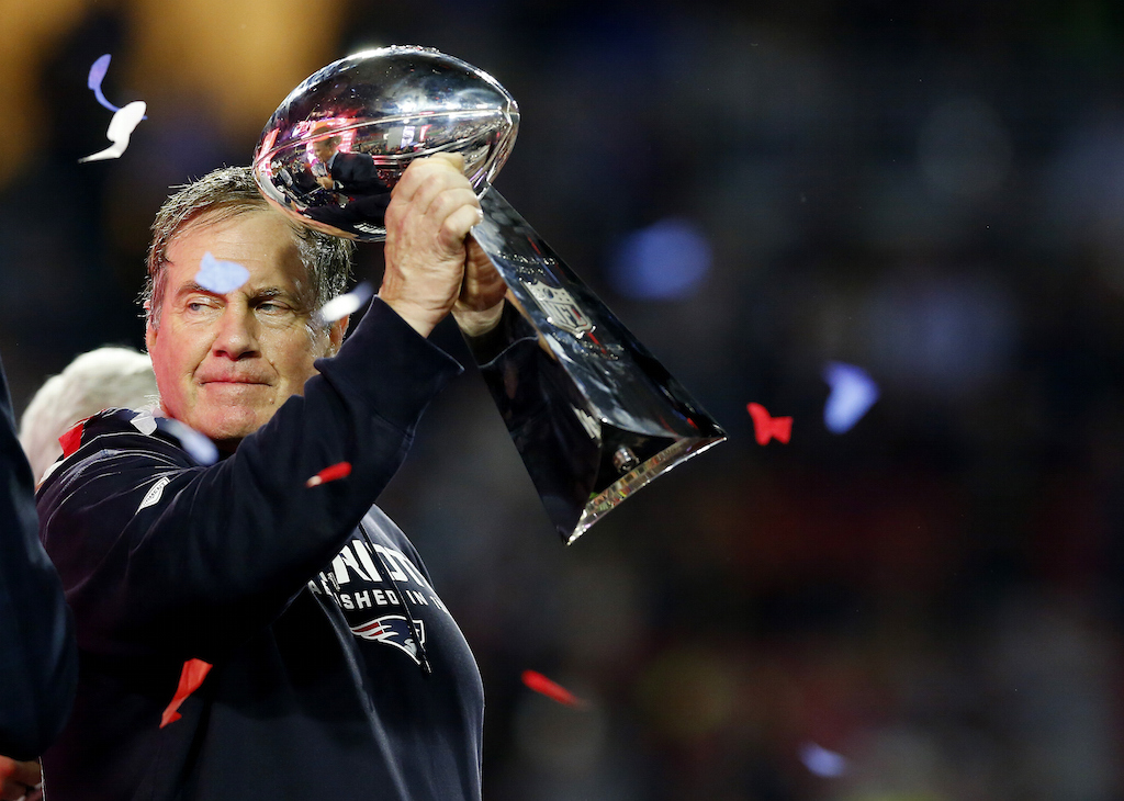 Bill Belichick hoists the Lombardi Trophy