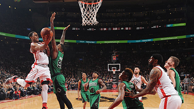 Toronto Raptors forward De Mar DeRozan drives to the basket against the Boston Celtics