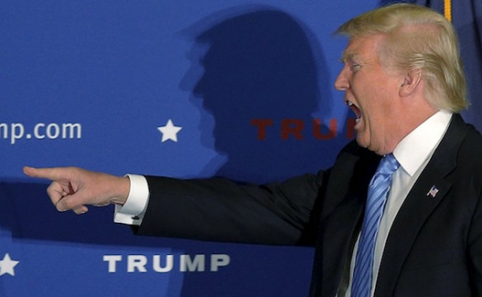 U.S. Republican presidential candidate Donald Trump takes the stage at a campaign rally in Windham New Hampshire