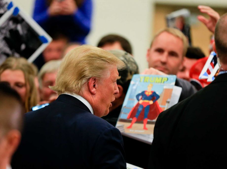 Republican presidential candidate Donald Trump meets with supporters following a campaign stop in Council Bluffs Iowa Tuesday Dec. 29 2015