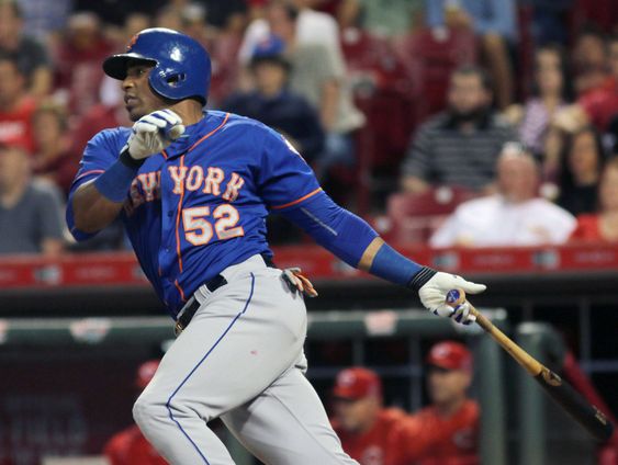 New York Mets Yoenis Cespedes hits an RBI single against the Cincinnati Reds in the seventh inning of a baseball game in Cincinnati. Cespedes is back with the New York Mets to beef up their offense