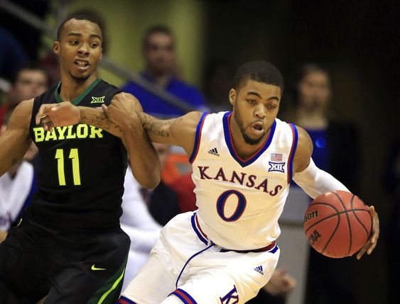 Mason III breaks away from Baylor guard Lester Medford during the first half of an NCAA college basketball game in Lawrence Kan. Saturday Jan. 2 2016