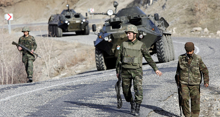 Turkish soldiers patrol a road near the Turkey Iraq border in the mainly Kurdish southeastern province of Sirnak