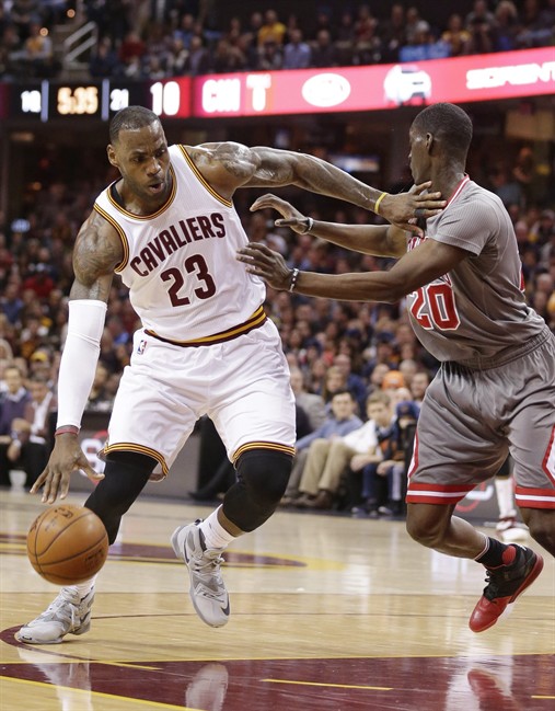 Cleveland Cavaliers Le Bron James drives past Chicago Bulls’ Tony Snell during the first half of an NBA basketball game Saturday Jan. 23 2016 in Cleveland