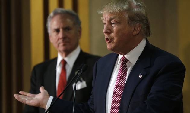 Republican presidential candidate Donald Trump right accompanied by South Carolina Lt. Gov. Henry McMaster speaks with members of the media during a news conference Monday Feb. 15 2016 in Hanahan S.C