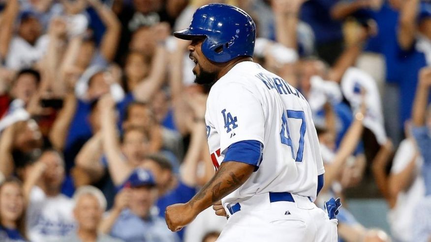 LOS ANGELES CA- OCTOBER 10 Howie Kendrick #47 of the Los Angeles Dodgers celebrates after he slides home safely to score on a two-RBI double by Adrian Gonzalez #23 of the Los Angeles Dodgers in the seventh inning against the New York Mets in game two