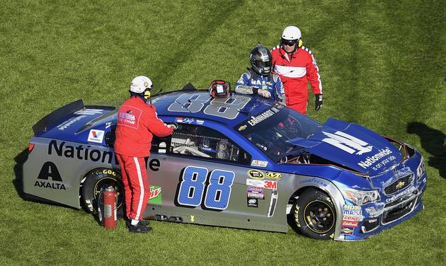 Dale Earnhardt Jr. is helped out of his car after hitting an interior wall as he was losing control of his car coming out of Turn 4 during the NASCAR Daytona 500 Sprint Cup series auto race at Daytona International Speedway Sunday Feb. 21 2016