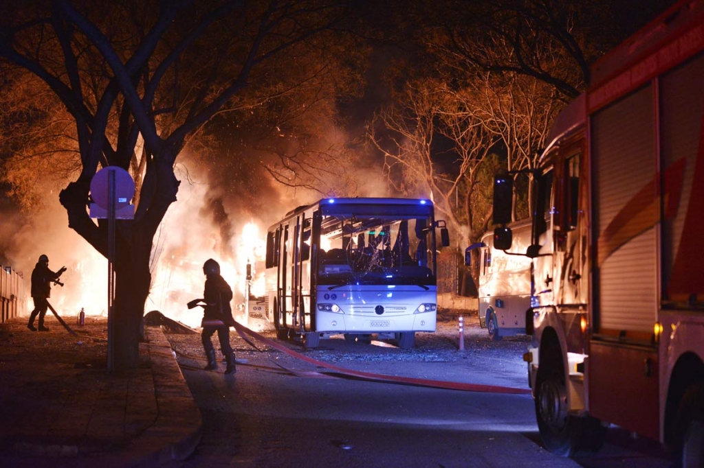 Firefighters work at a scene of fire from an explosion in Ankara Wednesday Feb. 17 2016