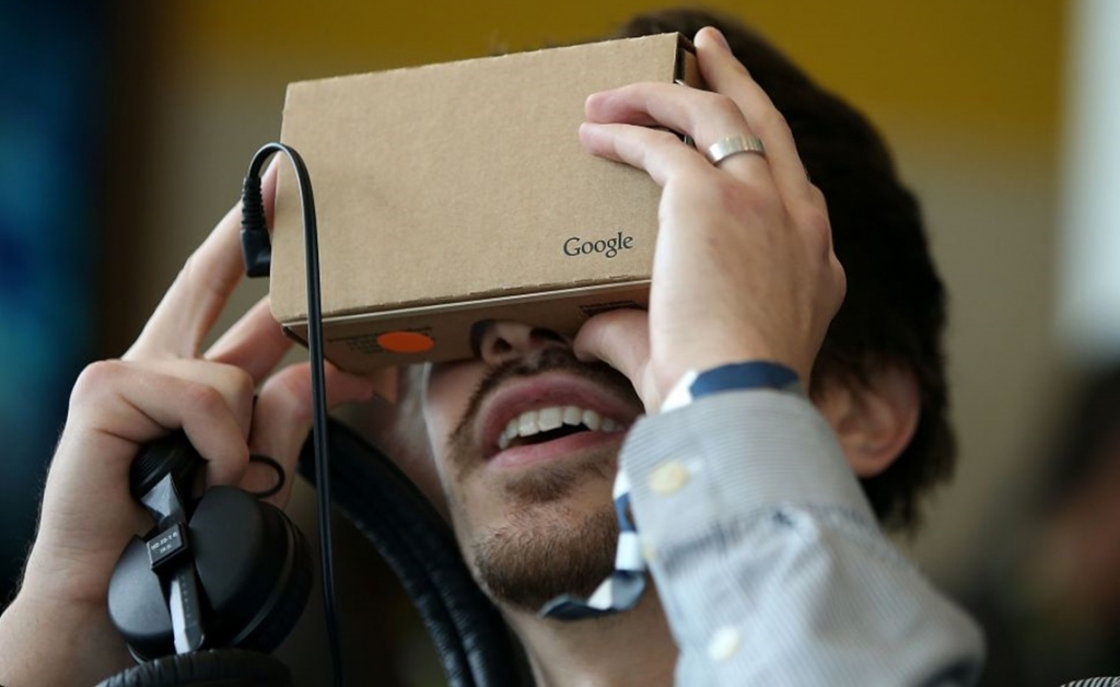 SAN FRANCISCO CA- MAY 28 An attendee inspects Google Cardboard during the 2015 Google I  O conference