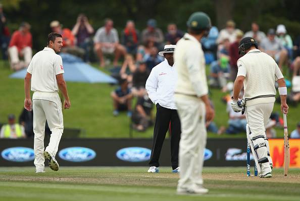 Josh Hazlewood has a few words with Corey Anderson