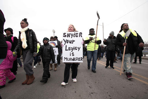 People participate in a national mile-long march to highlight the push for clean water in Flint Feb. 19 2016 in Flint Mich