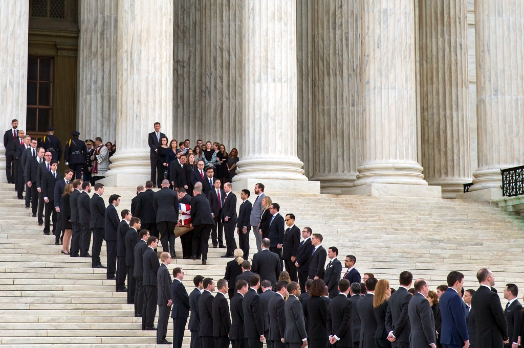 Supreme Court Scalia-3 The casket of Supreme Court Justice Antonin Scalia arrives Friday at the Supreme Court in Washington. Thousands of mourners paid their respects as his casket rested in the Great Hall of the court where he spent nearly three decade