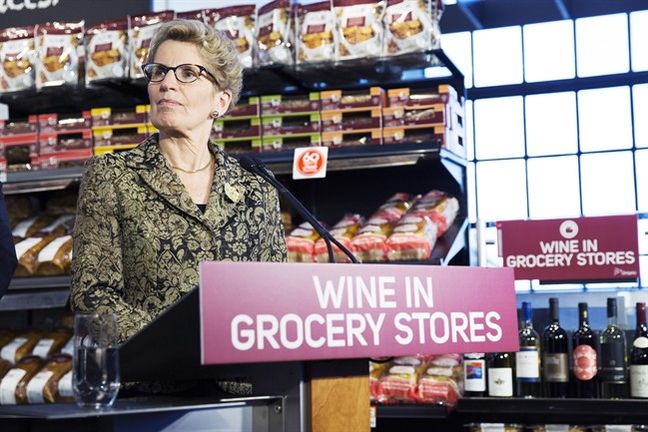 Ontario Premier Kathleen Wynne appears at a press conference in a Toronto supermarket on Thursday Feb. 18 2016 to formally announce that her government will open up wine sales in grocery stores across Ontario. THE CANADIAN PRESS  Michelle Siu