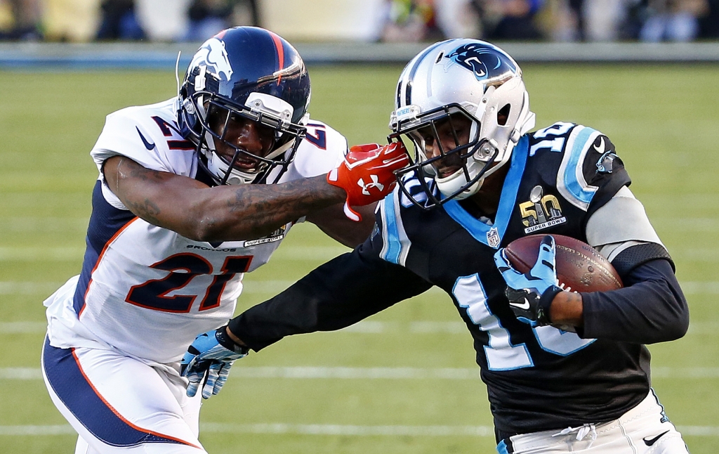 Corey Brown #10 of the Carolina Panthers runs after a catch as Aqib Talib #21 of the Denver Broncos grabs his facemask during the tackle in the second quarter during Super Bowl 50 at Levi's Stadium