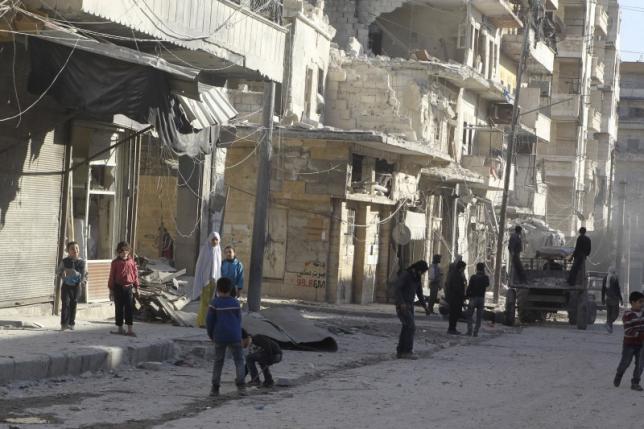 Residents inspect damage after an airstrike on the rebel held al Fardous neighbourhood of Aleppo Syria