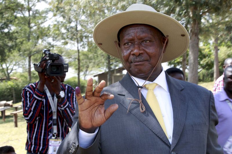 Uganda's incumbent President Yoweri Museveni displays his inked finger after casting his vote at a polling station during the presidential elections in Kirihura in western Uganda. – Reuters pic