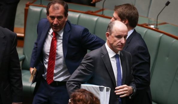 Stuart Robert walks past colleague Mal Brough on Thursday. Both have lost their portfolios