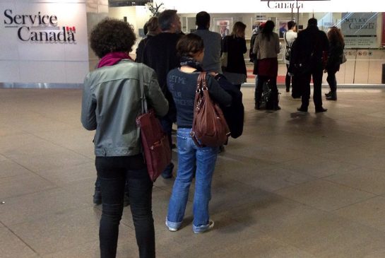 People wait for the Service Canada centre to open