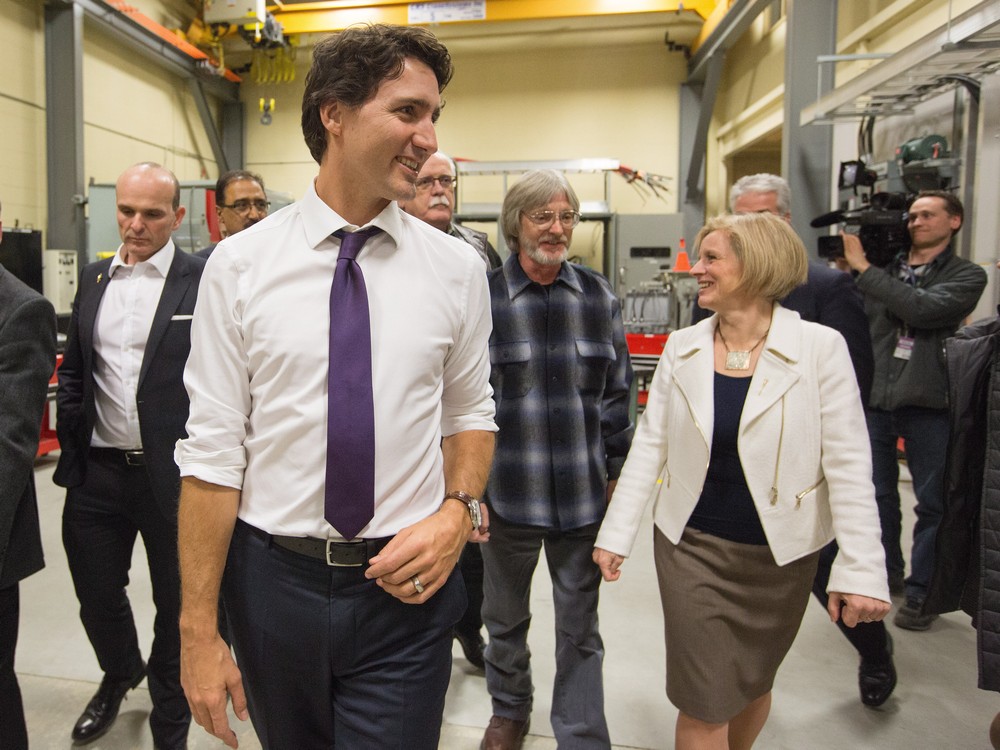 Prime Minister Justin Trudeau centre and Alberta Premier Rachel Notley right tour the International Brotherhood of Electrical Workers training facility in Edmonton Alberta on February 3